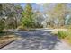 Long driveway with lots of mature trees at 1712 Alanson Dr, Deland, FL 32724