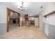 Spacious kitchen features tile floors, stainless appliances, wood cabinets and large bar at 1712 Alanson Dr, Deland, FL 32724