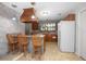 Functional kitchen features wood cabinets and a breakfast bar at 1712 Alanson Dr, Deland, FL 32724