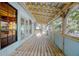 Screened porch with wood floors and ceiling offers backyard views at 1712 Alanson Dr, Deland, FL 32724