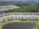 Aerial view of the neighborhood featuring many similar homes and a large green space at 1716 Red Rock Rd, New Smyrna Beach, FL 32168