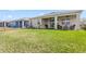 Lovely backyard with a covered patio that is perfect for entertaining and relaxing at 1716 Red Rock Rd, New Smyrna Beach, FL 32168