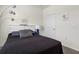 Bedroom featuring neutral carpet, furnishings, and a white storage headboard at 1716 Red Rock Rd, New Smyrna Beach, FL 32168