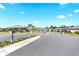 Well-maintained neighborhood street with neatly landscaped yards and sidewalks at 1716 Red Rock Rd, New Smyrna Beach, FL 32168