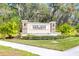 The stone entrance sign reads Oak Leaf Preserve at 1716 Red Rock Rd, New Smyrna Beach, FL 32168