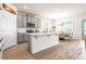 Modern kitchen featuring gray cabinetry, white countertops, stainless steel appliances, and a central island at 1716 Red Rock Rd, New Smyrna Beach, FL 32168