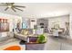 Open-concept living and dining area featuring modern decor, tile flooring, and a view into the kitchen at 1716 Red Rock Rd, New Smyrna Beach, FL 32168
