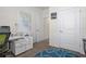 Office featuring a printer, desk, and colorful decor at 1716 Red Rock Rd, New Smyrna Beach, FL 32168