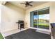 The covered patio includes a grill, perfect for outdoor cooking and entertaining guests at 1716 Red Rock Rd, New Smyrna Beach, FL 32168