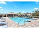Community pool featuring lounge chairs, a covered seating area, and a clear blue swimming pool at 1716 Red Rock Rd, New Smyrna Beach, FL 32168