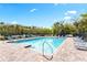 Community swimming pool with lounge chairs at 1716 Red Rock Rd, New Smyrna Beach, FL 32168