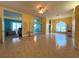 Open-concept living area with tile floors, decorative columns, and connecting views to other rooms at 1751 Creekwater Blvd, Port Orange, FL 32128