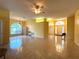 Spacious living room with tile flooring, abundant natural light, and an open floor plan at 1751 Creekwater Blvd, Port Orange, FL 32128