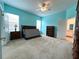 Spacious main bedroom with carpet and a ceiling fan, filled with natural light at 1751 Creekwater Blvd, Port Orange, FL 32128