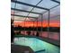 Enclosed pool with twilight sky view and water feature at 1751 Creekwater Blvd, Port Orange, FL 32128