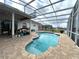 Private screened-in pool area with stone patio and water view at 1751 Creekwater Blvd, Port Orange, FL 32128