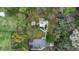 Expansive aerial view of the property with lush greenery and mature trees surrounding the charming home at 1930 S Clara Ave, Deland, FL 32720