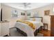 Bright bedroom with a comfortable queen bed, ceiling fan, and natural light from the windows at 1930 S Clara Ave, Deland, FL 32720