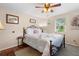 Comfortable bedroom with a queen bed, ceiling fan, and ample natural light at 1930 S Clara Ave, Deland, FL 32720