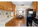 Compact kitchen featuring wood cabinets and hardwood floors at 1930 S Clara Ave, Deland, FL 32720