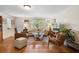 Charming living room with hardwood floors, comfortable seating, and a bright, airy atmosphere at 1930 S Clara Ave, Deland, FL 32720