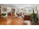 Inviting living room with hardwood floors, natural light, and an open layout to the dining area at 1930 S Clara Ave, Deland, FL 32720