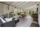 Inviting covered patio with stylish furniture, dining table, and lattice accents for relaxed outdoor entertainment at 1930 S Clara Ave, Deland, FL 32720