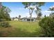 Expansive backyard with lush lawn and mature trees at 1986 Big Oak Dr, South Daytona, FL 32119