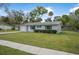Charming single-story home with a well-manicured lawn at 1986 Big Oak Dr, South Daytona, FL 32119