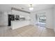 Bright kitchen with white cabinets, modern appliances, and a large open floor plan at 1986 Big Oak Dr, South Daytona, FL 32119