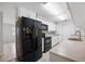 Modern kitchen featuring stainless steel appliances and ample counter space at 1986 Big Oak Dr, South Daytona, FL 32119