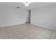 Spacious living room with neutral tile flooring and modern lighting at 1986 Big Oak Dr, South Daytona, FL 32119