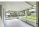 Large screened porch provides a relaxing space overlooking the backyard at 1986 Big Oak Dr, South Daytona, FL 32119