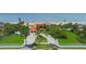 Grand oceanfront estate with gated entry, manicured landscaping, and direct beach access for luxurious coastal living at 201 Ocean Shore Blvd, Ormond Beach, FL 32176