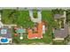 An aerial view showcases the entire estate with a pool, ocean access, and lush landscaping at 201 Ocean Shore Blvd, Ormond Beach, FL 32176