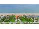 A stunning aerial view of a coastal estate with a beach and lush landscaping at 201 Ocean Shore Blvd, Ormond Beach, FL 32176