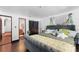 Comfortable bedroom boasts stylish accents and an adjoining bathroom with vintage-inspired decor, creating a cozy retreat at 201 Ocean Shore Blvd, Ormond Beach, FL 32176