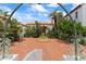 Charming courtyard with red brickwork and a decorative fountain, framed by wrought iron archway at 201 Ocean Shore Blvd, Ormond Beach, FL 32176