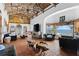 Spacious living room featuring a vaulted wood ceiling, terracotta tile floor, and an ocean view at 201 Ocean Shore Blvd, Ormond Beach, FL 32176