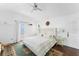 Bright main bedroom with plush bed, stylish decor, and an ocean view at 201 Ocean Shore Blvd, Ormond Beach, FL 32176