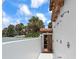 View of the outdoor shower with a wooden door and several shower heads, and beachy landscaping at 201 Ocean Shore Blvd, Ormond Beach, FL 32176