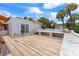 Spacious roof deck with marble counters, wood-look tile flooring, and stainless pizza oven at 201 Ocean Shore Blvd, Ormond Beach, FL 32176