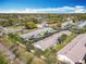 An aerial view captures the neighborhood's layout of single-story homes and tree lined streets at 202 Oakleigh Dr # 90, Deland, FL 32724