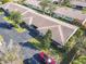 An aerial view of a home showcasing the roof, driveway, and surrounding landscape at 202 Oakleigh Dr # 90, Deland, FL 32724