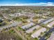 Picturesque aerial of residential single Gathering homes near recreational areas such as tennis courts at 202 Oakleigh Dr # 90, Deland, FL 32724