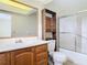 Bathroom with wood vanity and a shower-tub combo at 202 Oakleigh Dr # 90, Deland, FL 32724