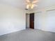 Neutral bedroom with plush carpet and double closets at 202 Oakleigh Dr # 90, Deland, FL 32724