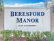 Entrance sign for the Beresford Manor over 55 community with manicured landscaping at 202 Oakleigh Dr # 90, Deland, FL 32724