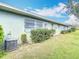 Green grass and landscape near the back of the townhouse at 202 Oakleigh Dr # 90, Deland, FL 32724