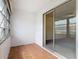 Florida room with tile flooring, textured walls, and sliding glass door entrance at 202 Oakleigh Dr # 90, Deland, FL 32724